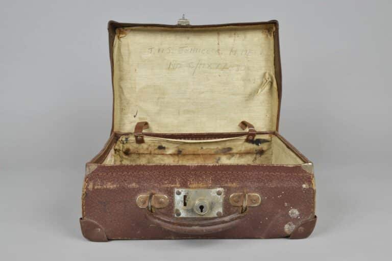 2019.38.2 Small brown suitcase