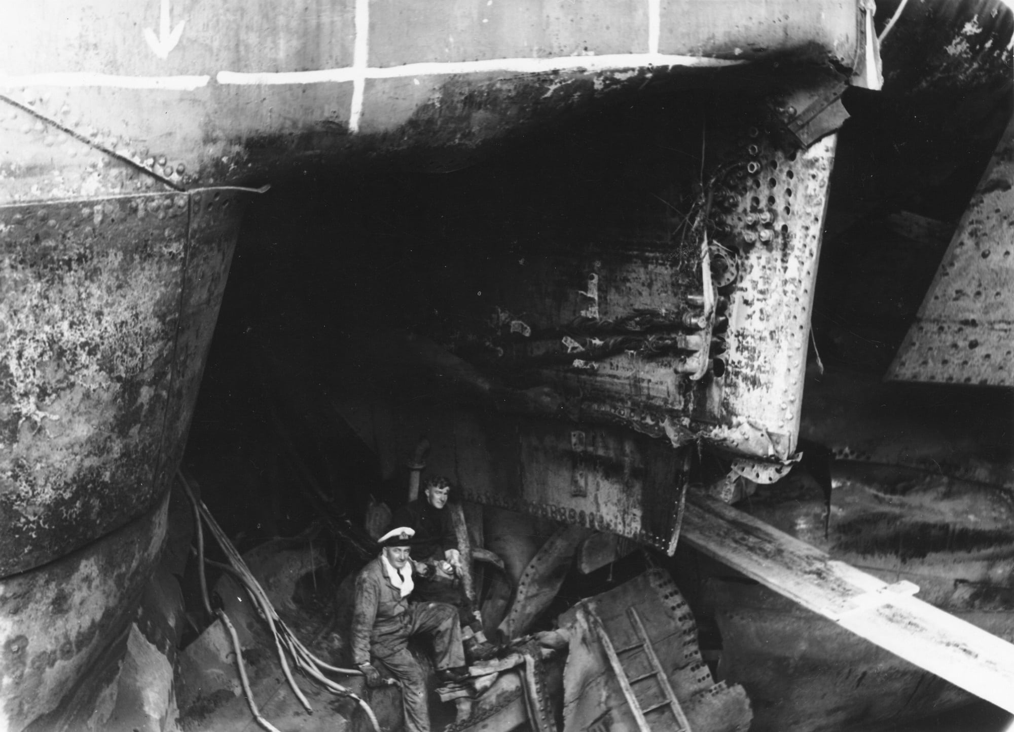 Inspecting torpedo damage AAG 0022 Inspecting torpedo damage on the HMNZS Leander