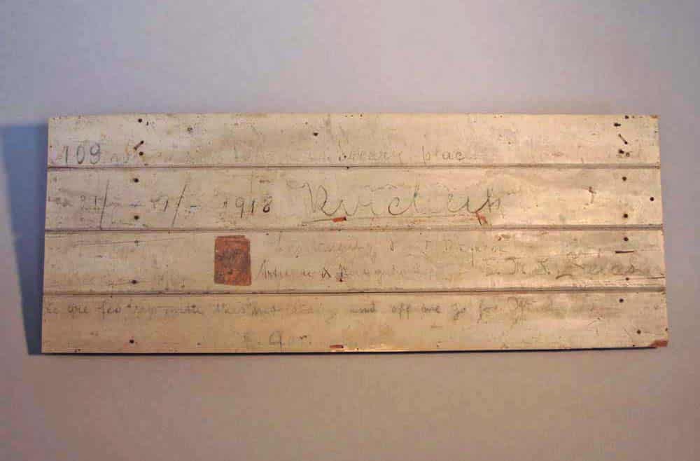 GLG 0005 Section of Count Felix von Luckner’s wooden cell from his internment on Ripapa Island, Lyttleton Harbour. Section of Count Felix von Luckner’s wooden cell from his internment on Ripapa Island, Lyttleton Harbour. The writing reads “109 weary days in this dreary place…we are fed up with this…and off we go…”