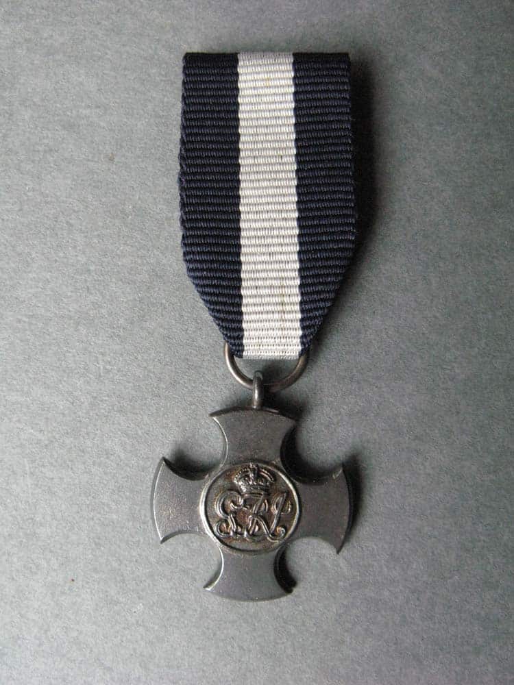 Distinguished Service Cross miniature medal awarded to Lt Malcolm Kirkwood for saving his ship during the raid on Ostend 22-23 April 1918 Distinguished Service Cross miniature medal awarded to Lt Malcolm Kirkwood for saving his ship during the raid on Ostend 22-23 April 1918